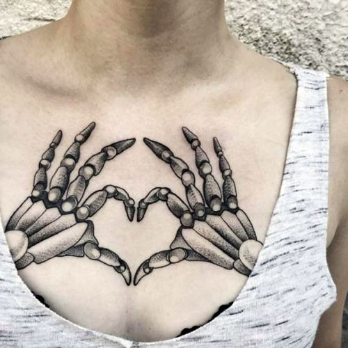 Skeleton Hand Holding Heart Tattoo