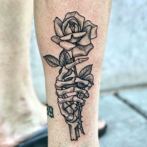 Hand Holding Rose Tattoo designs 