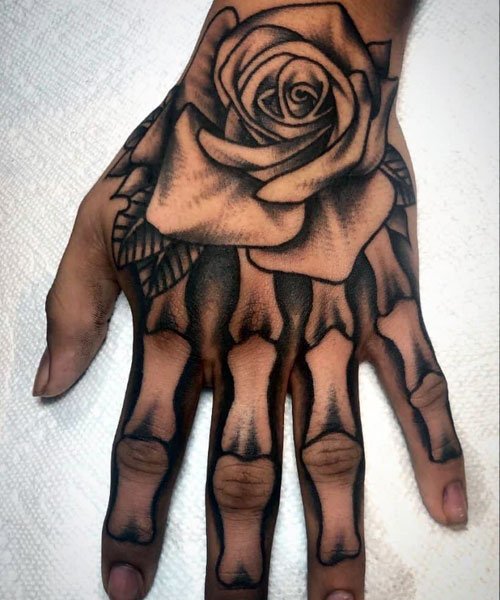 Rose and Skeleton Hand Tattoo