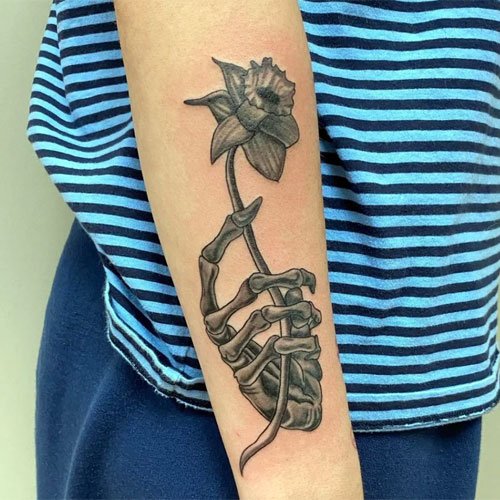 Skeleton Hand Holding Rose Tattoo