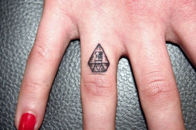 Illuminati Finger Tattoo