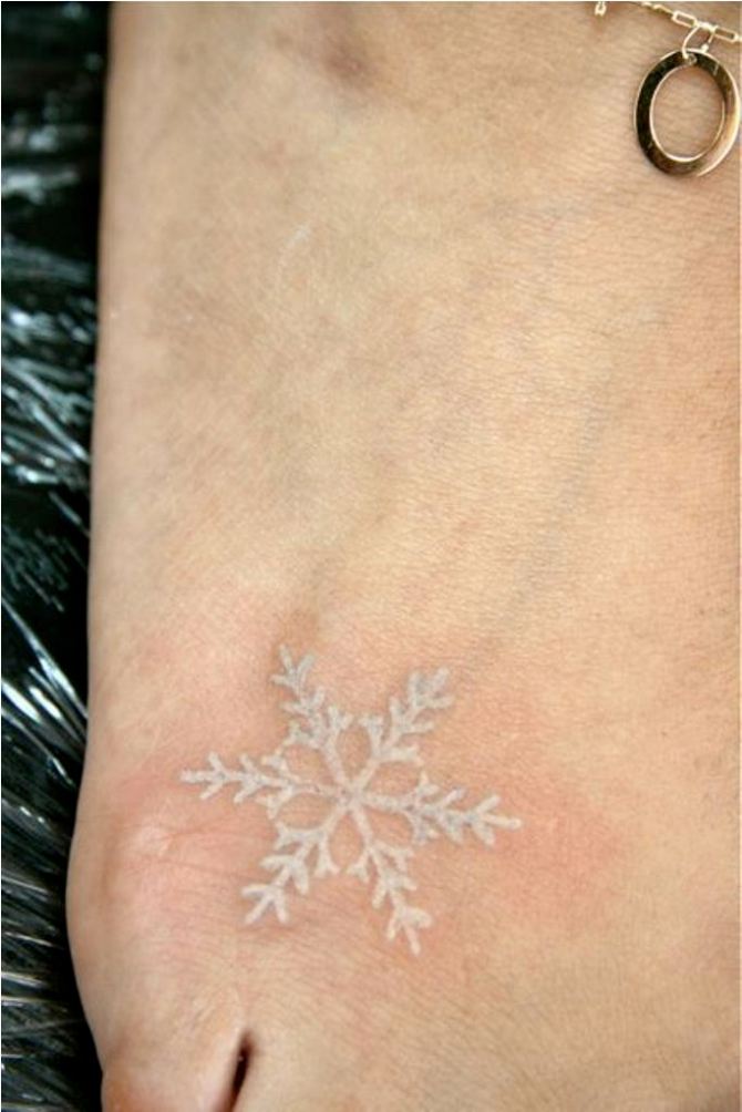 White Ink Snowflake Tattoo