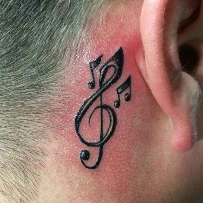 32-treble-clef-behind-ear-tattoo