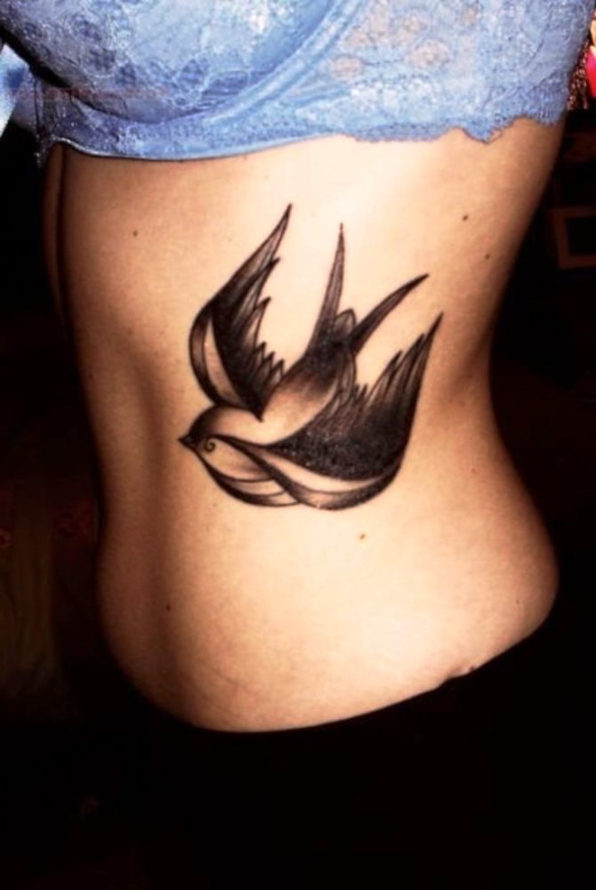 Swallow on Ribs Tattoo